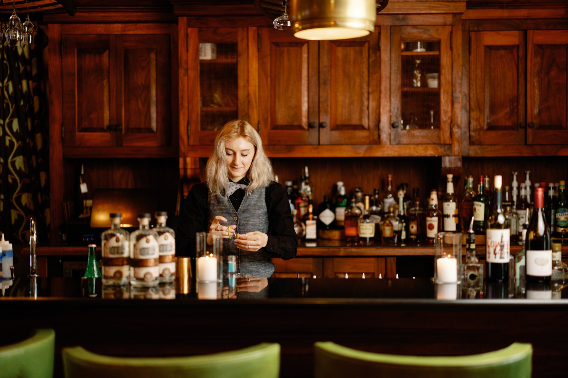 a woman standing at a bar
