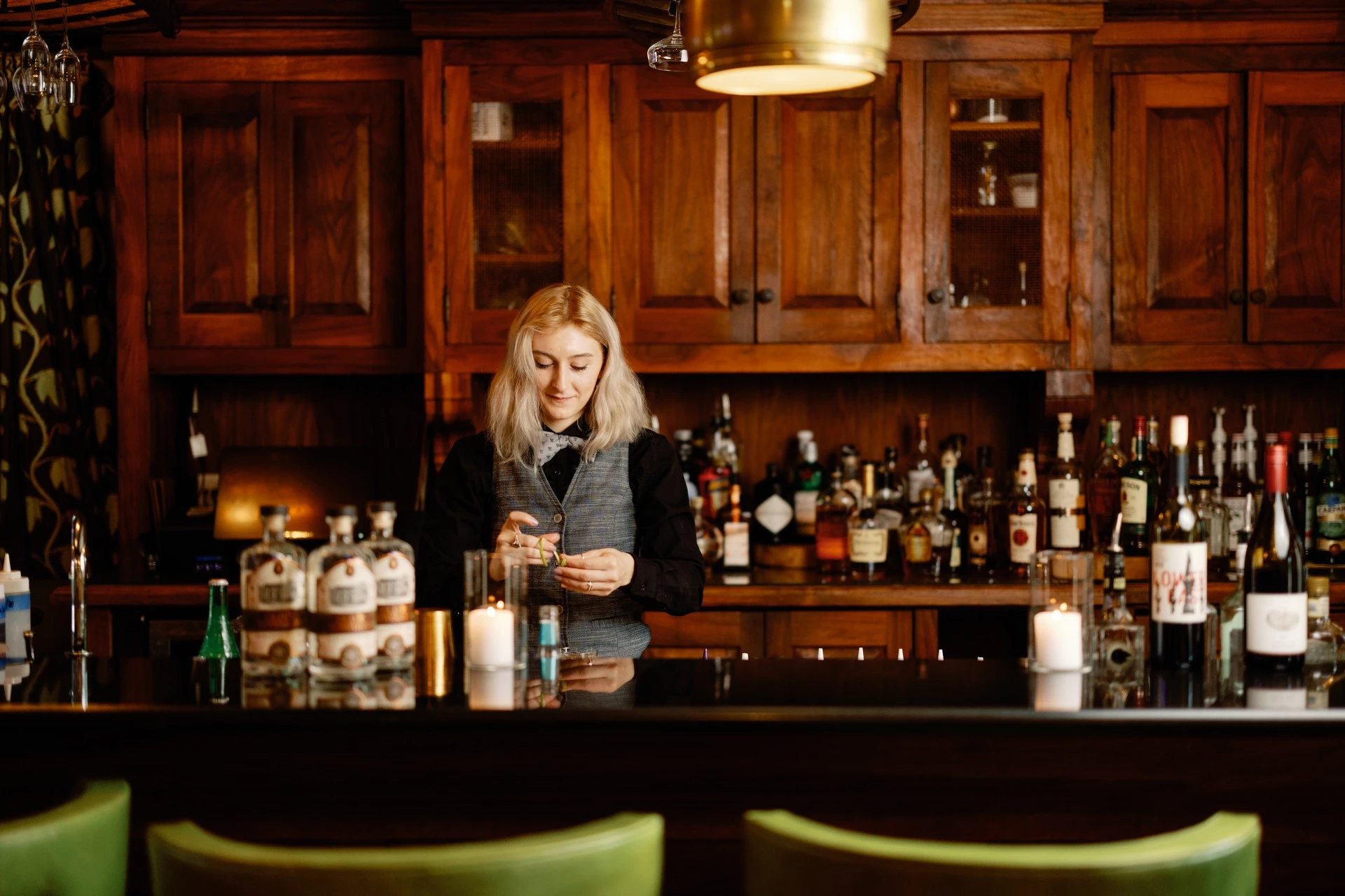 a woman standing at a bar