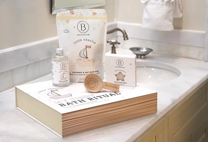 a book and a bath kit on a counter