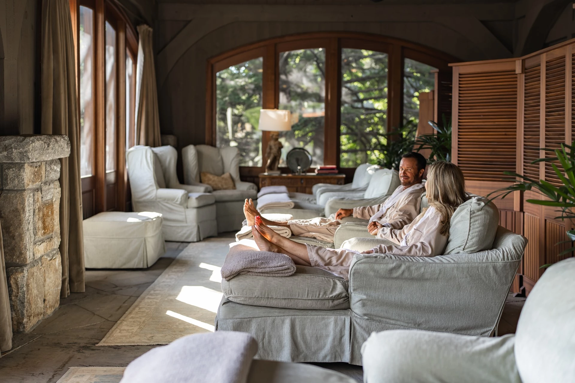 a man and woman sitting on a couch