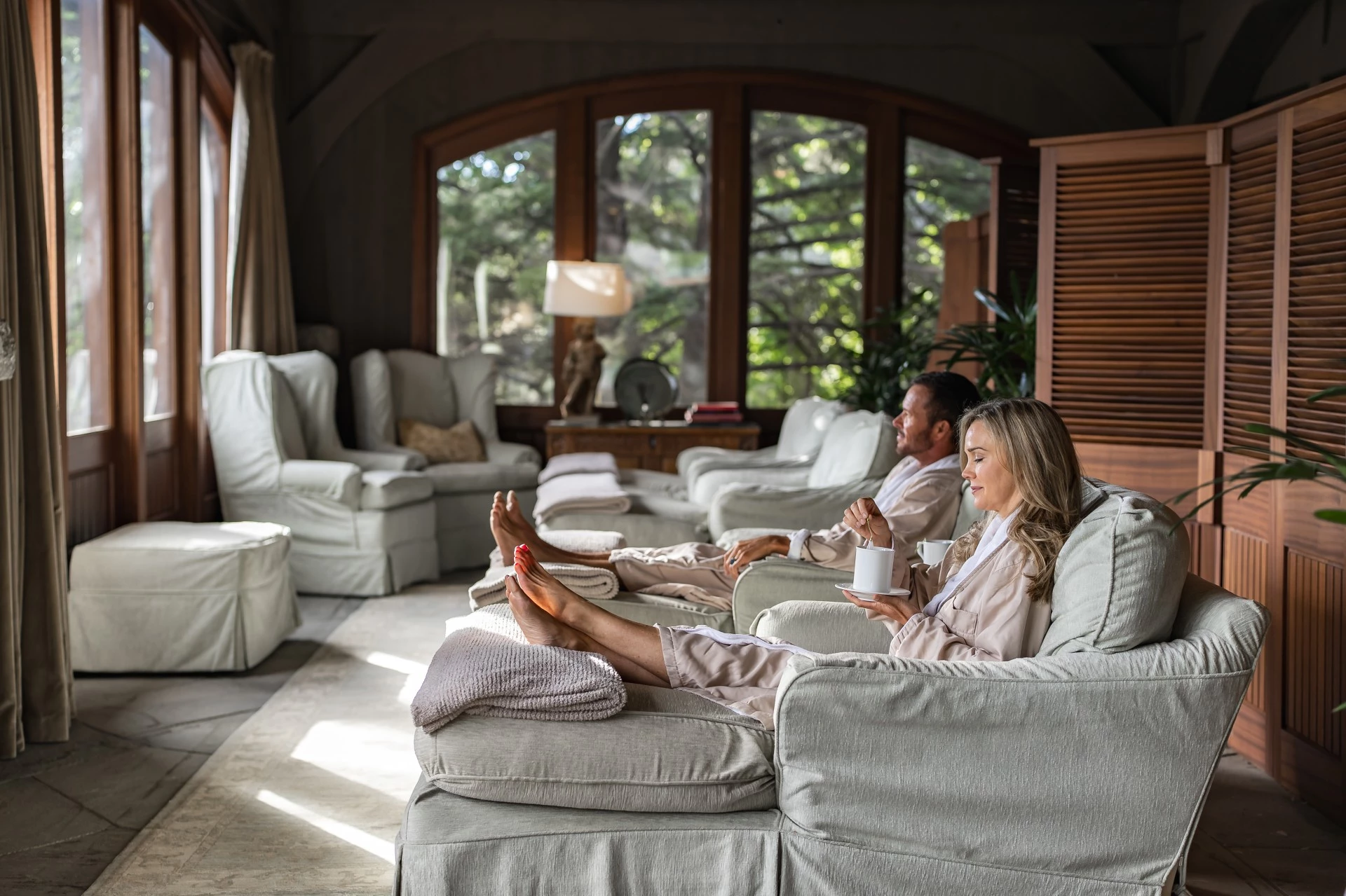a man and woman sitting on couches