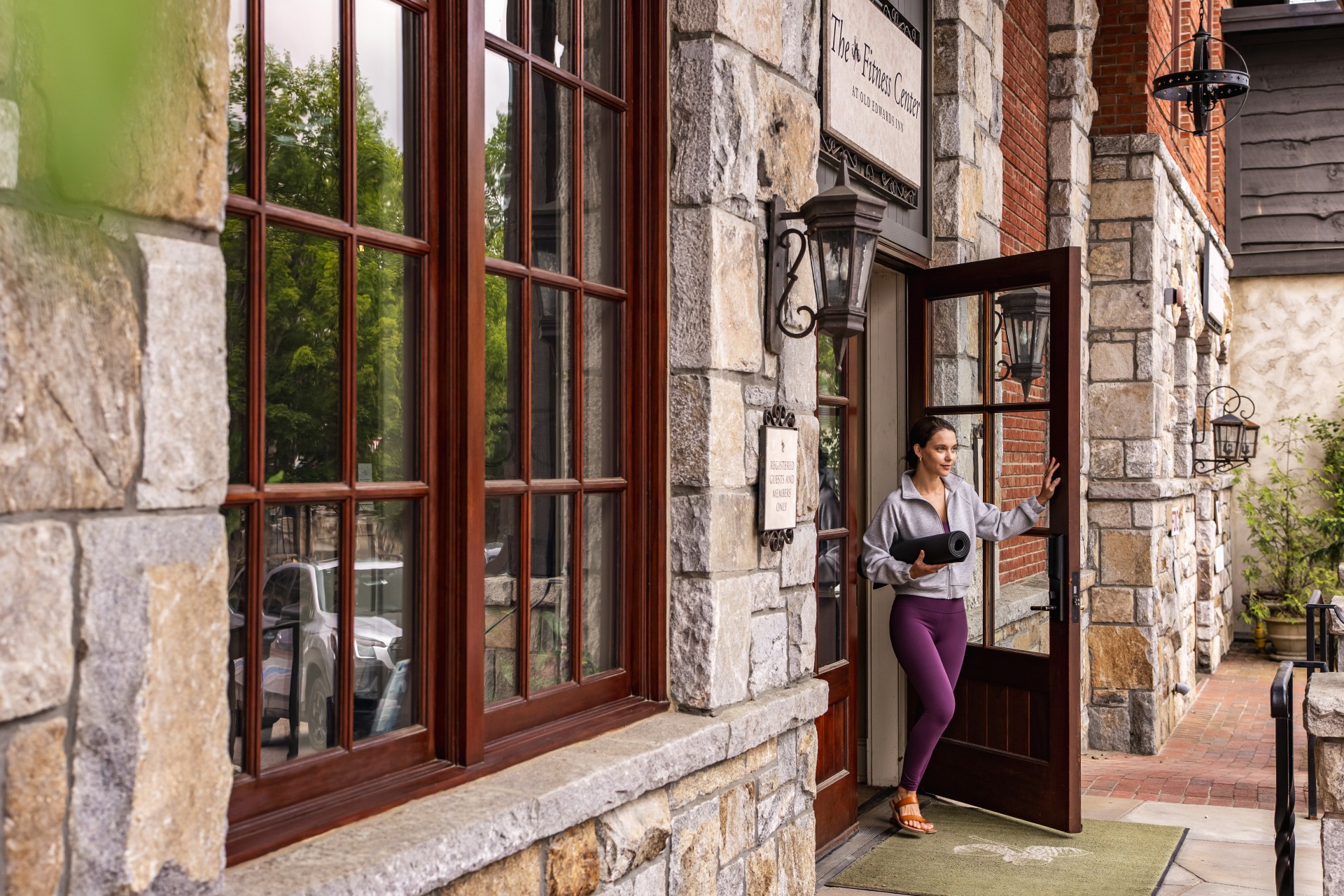 a woman standing in front of a building