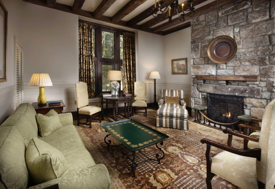 a living room with a fireplace and a couch