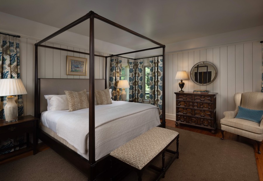 a bedroom with a four poster bed