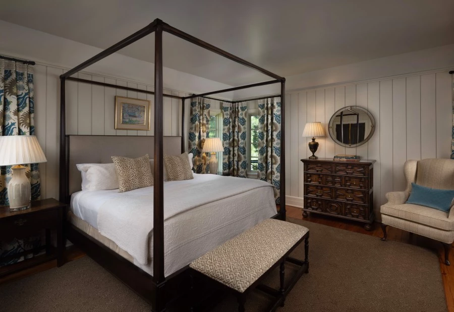 a bedroom with a four poster bed