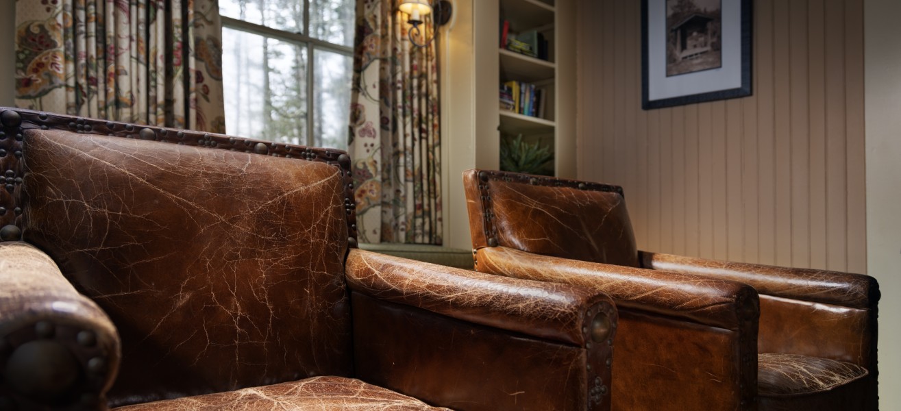 a brown leather chair in a room