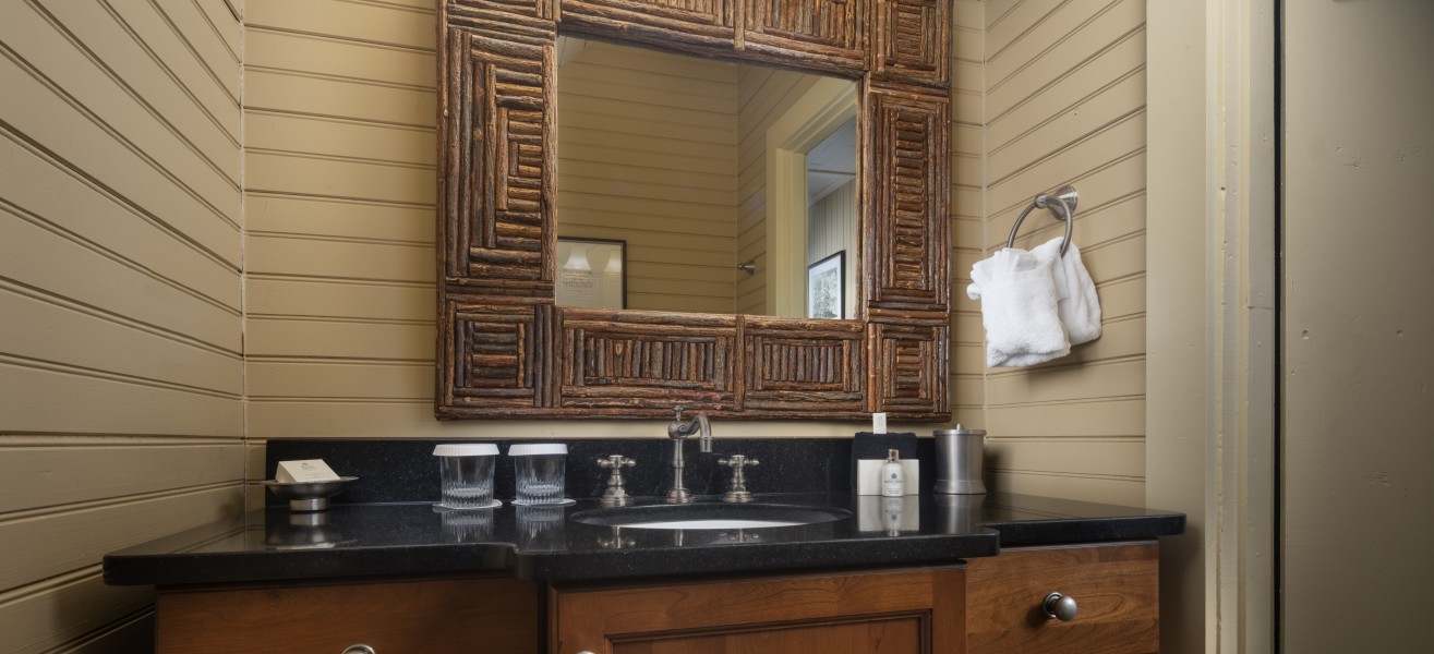 a bathroom with a mirror and a sink