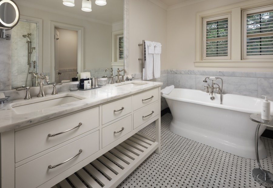 a bathroom with a tub and sink