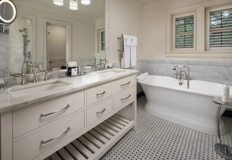 a bathroom with a tub and sink