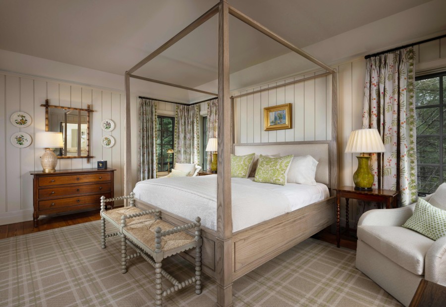 a bedroom with a four poster bed