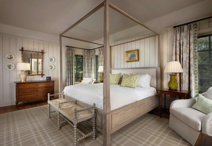 a bedroom with a four poster bed