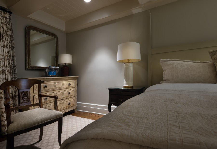 a bedroom with a bed and a dresser