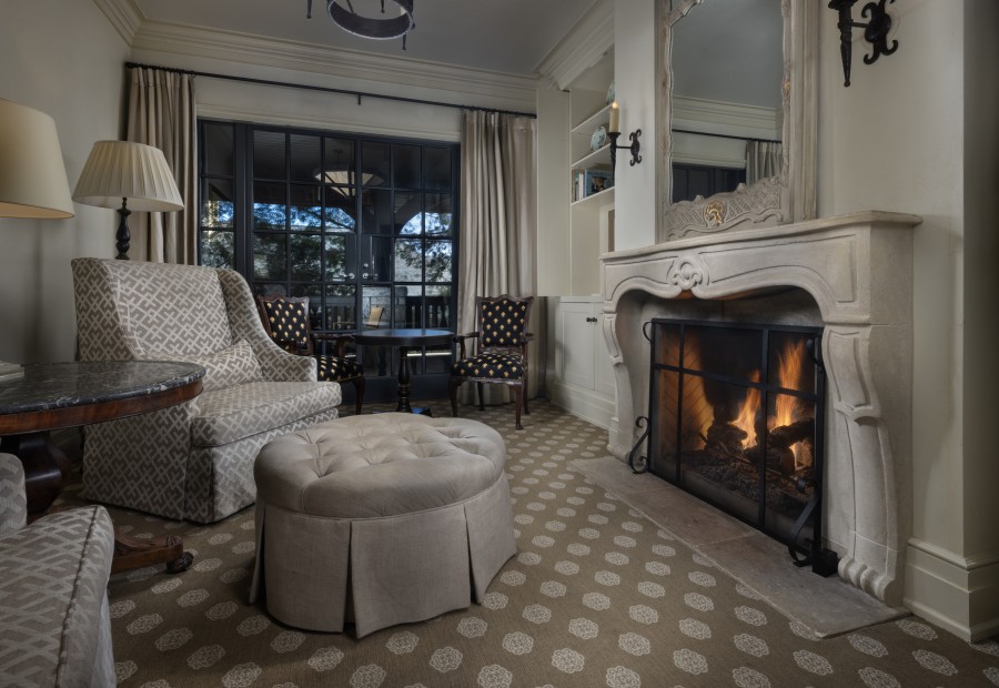 a living room with a fireplace and a couch