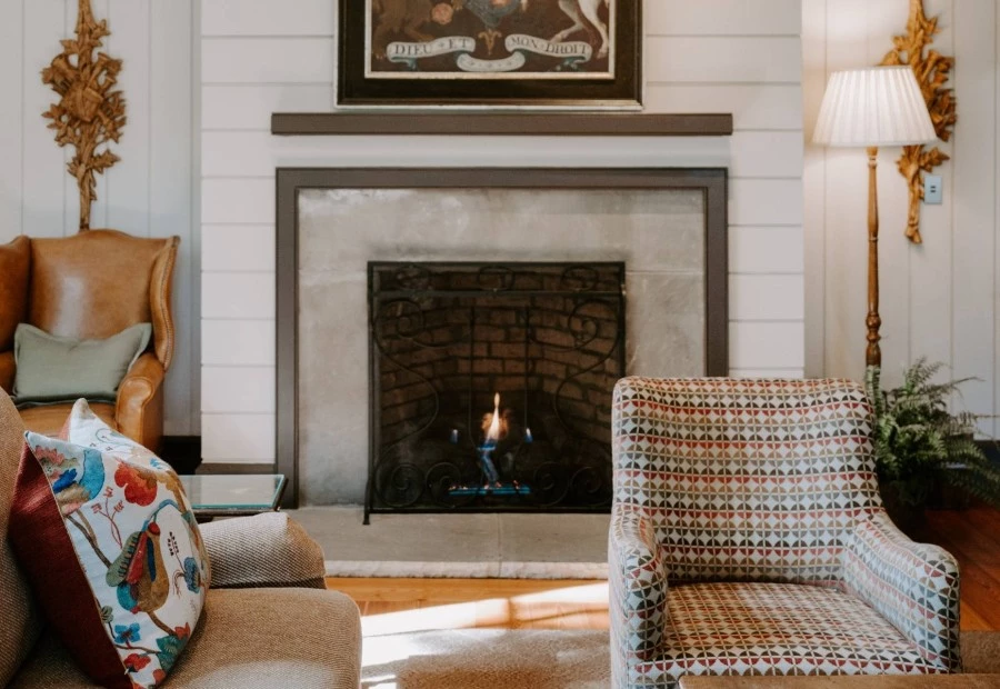 a fireplace with a picture above it