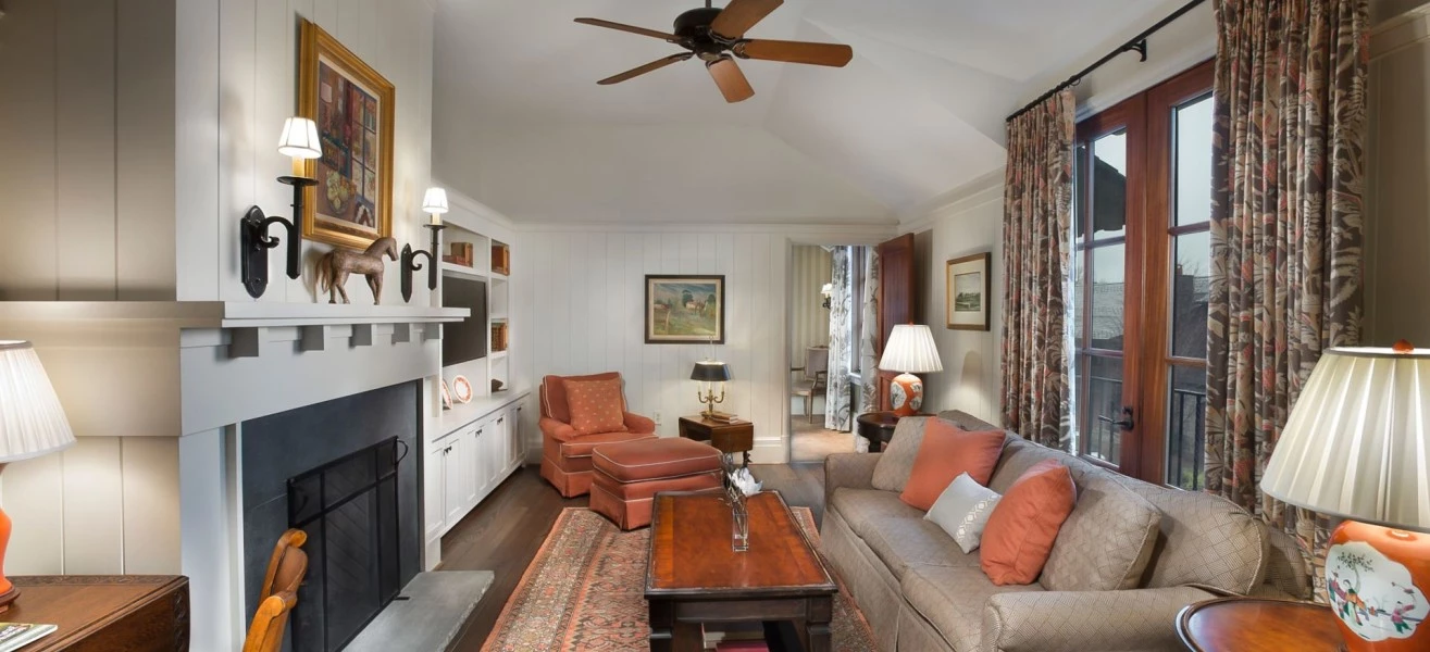 a living room with a fireplace and couches