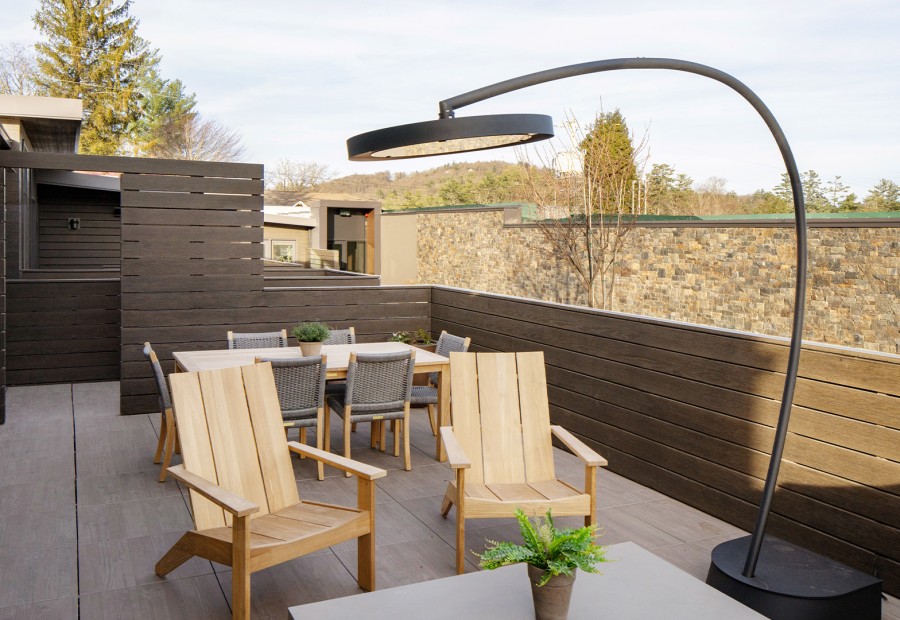 a patio with chairs and a table