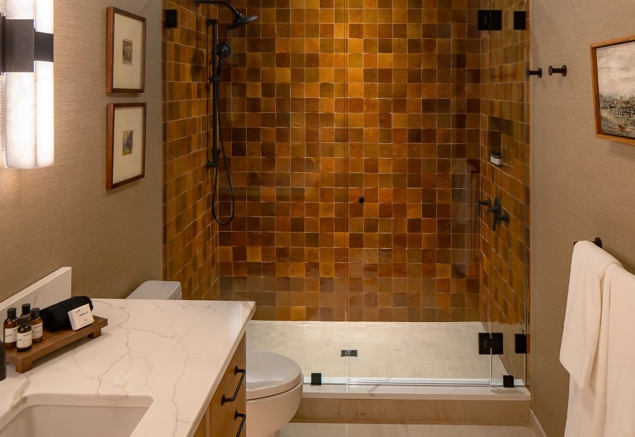 a bathroom with a shower and sink