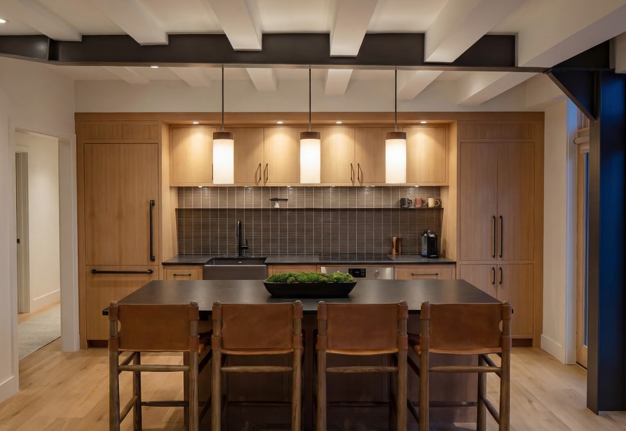 a kitchen with a table and chairs
