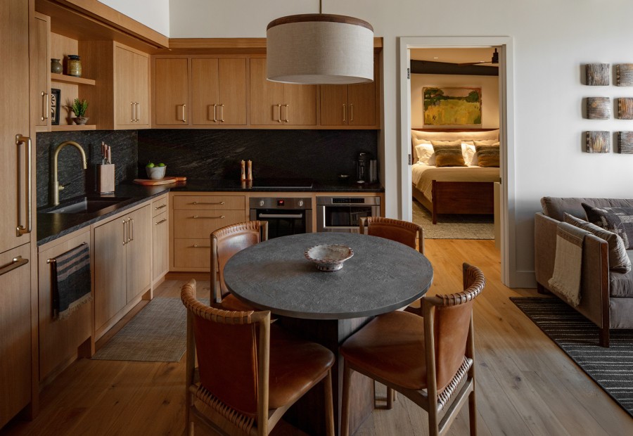 a kitchen with a table and chairs