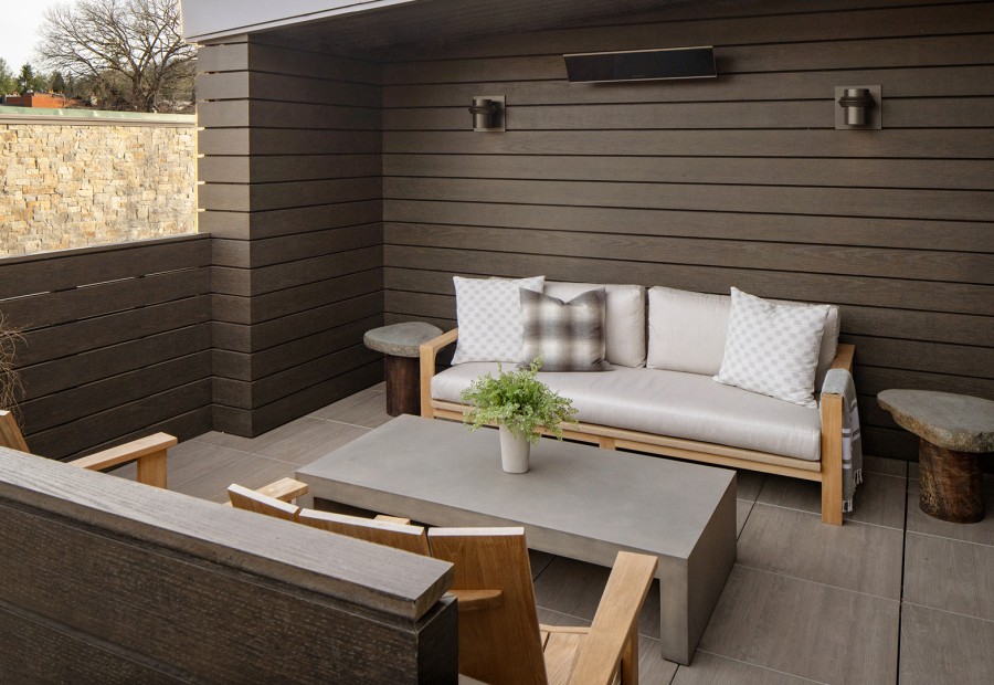 a patio with a couch and a table