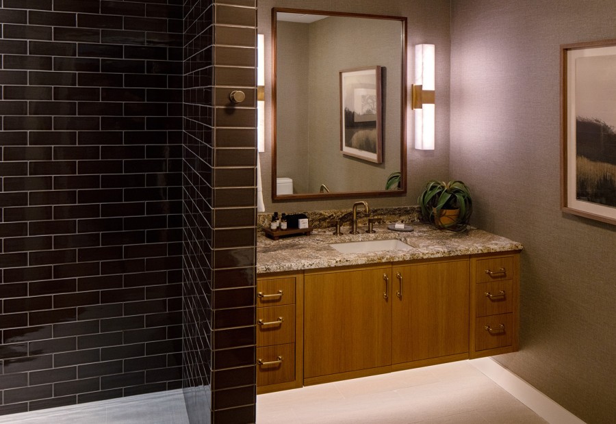a bathroom with a mirror and a sink