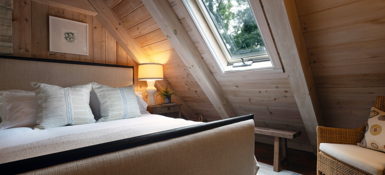 a bed in a room with a window