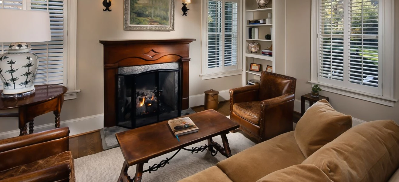 a living room with a fireplace and a couch