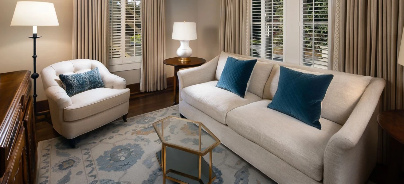 a living room with a couch and a lamp