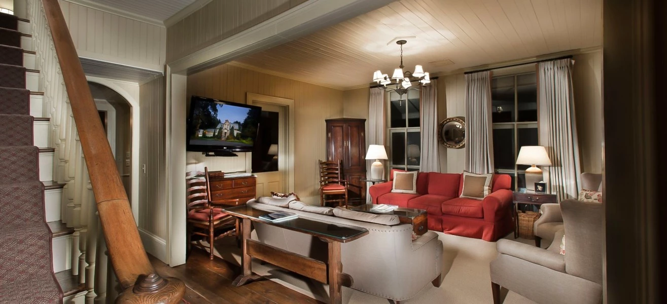 a living room with a television and a couch