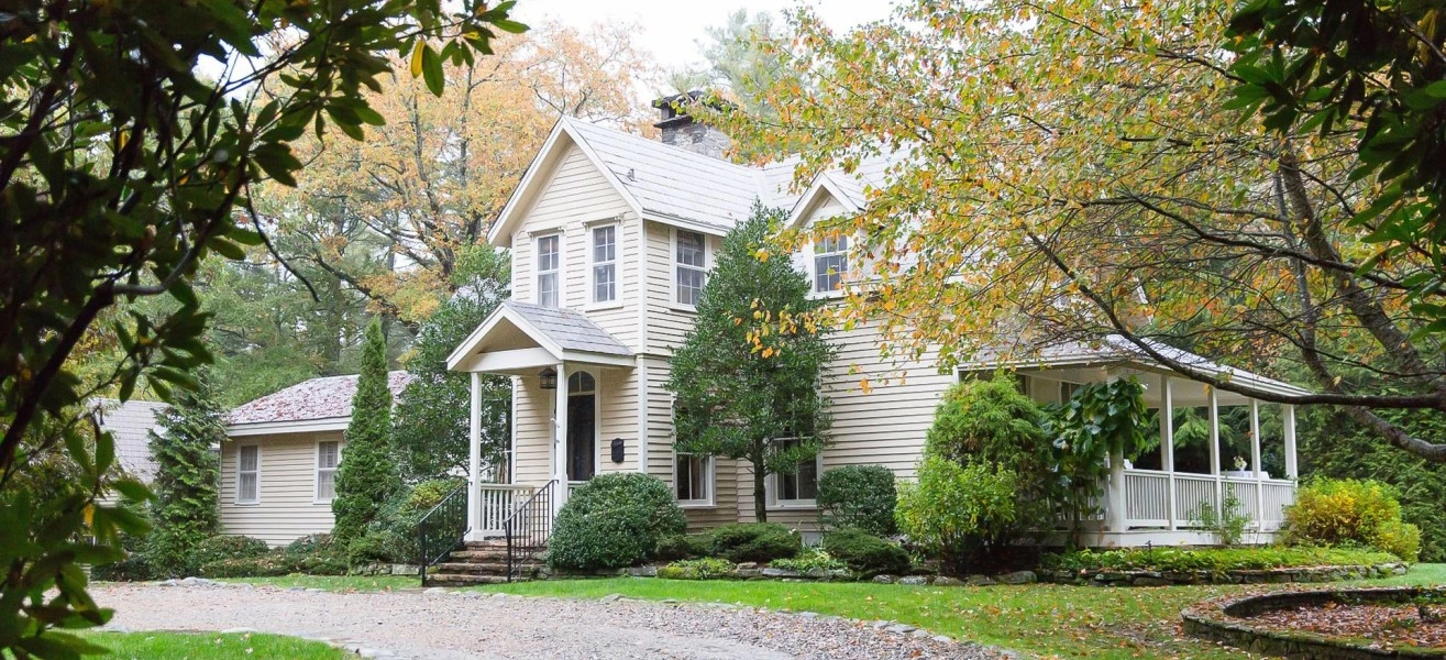 a house with trees and a driveway