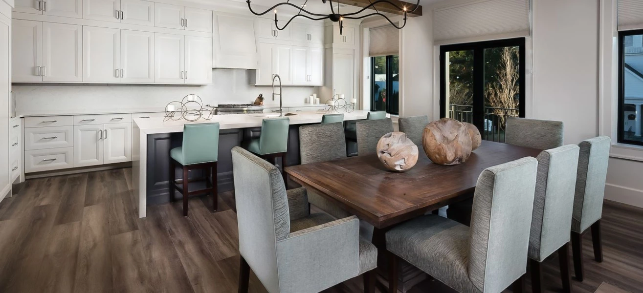 a kitchen with a dining table and chairs