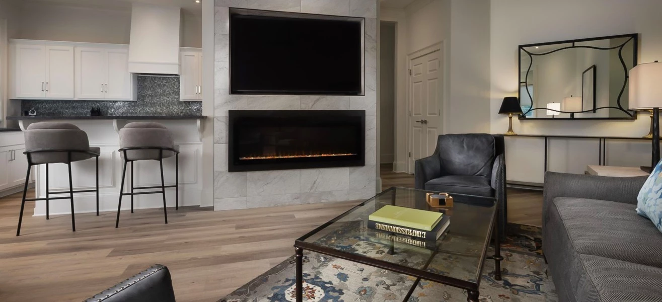 a living room with a fireplace and a tv