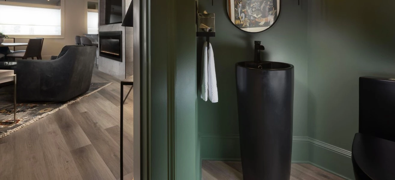 a bathroom with a black sink and a mirror