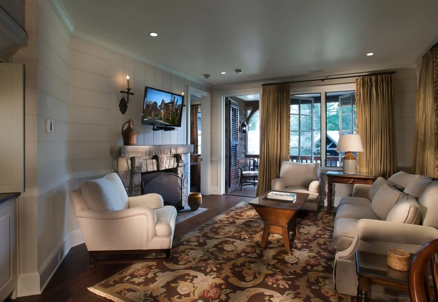 a living room with a fireplace and couches