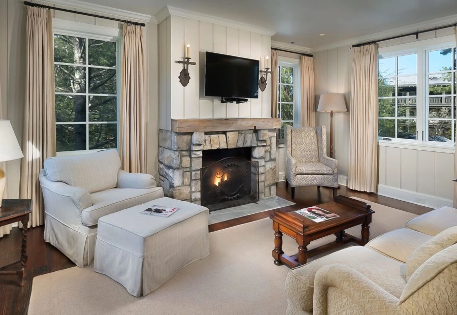 a living room with a fireplace and a television