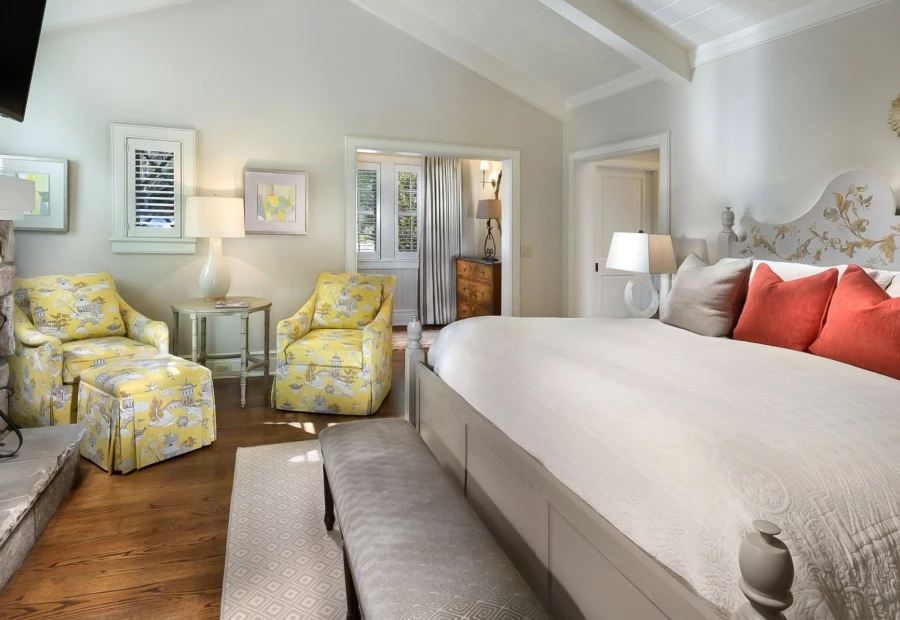 a bedroom with a bed and a bench