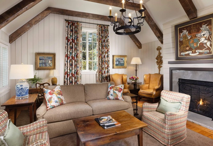 a living room with a couch and chairs