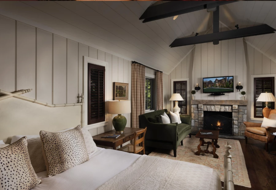 a room with a fireplace and a bed