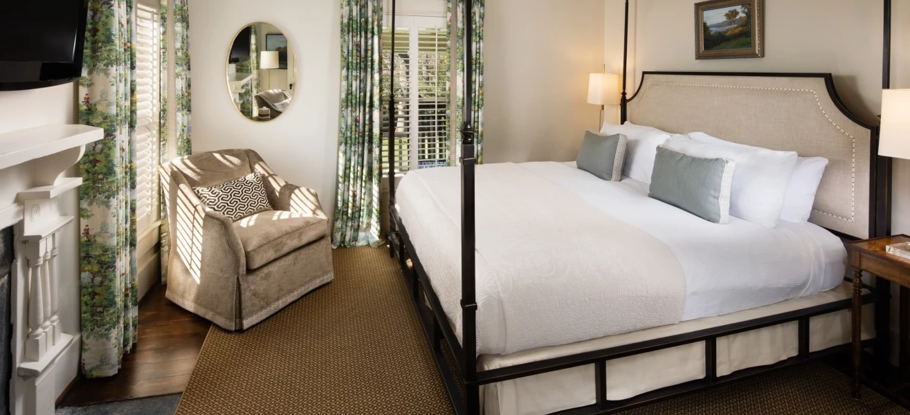 a room with a bed and chair