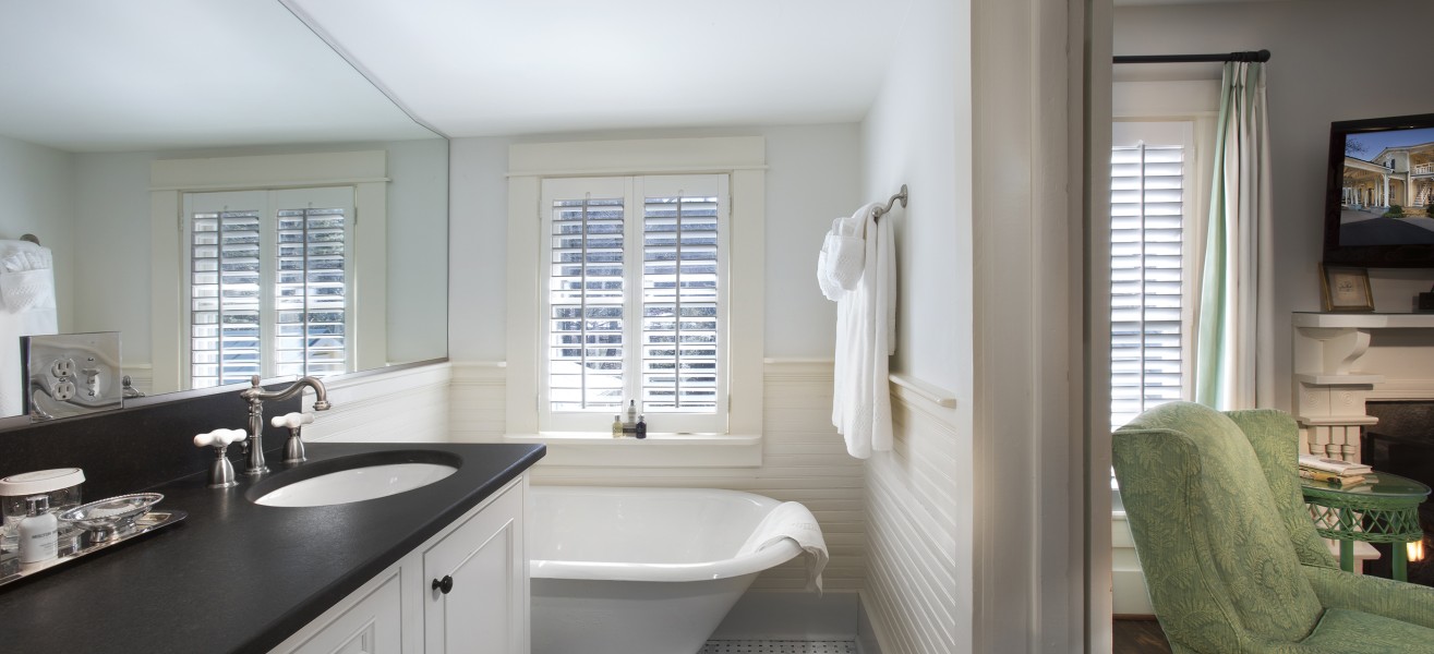 a bathroom with a tub and sink