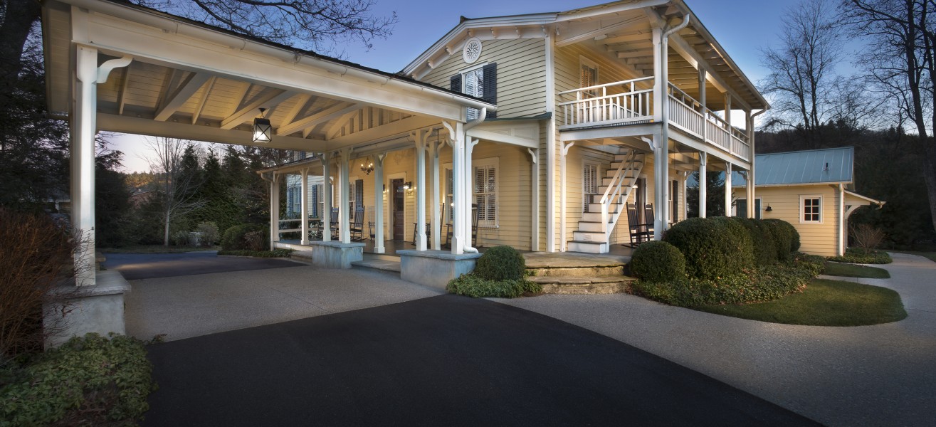 a house with a porch and a driveway
