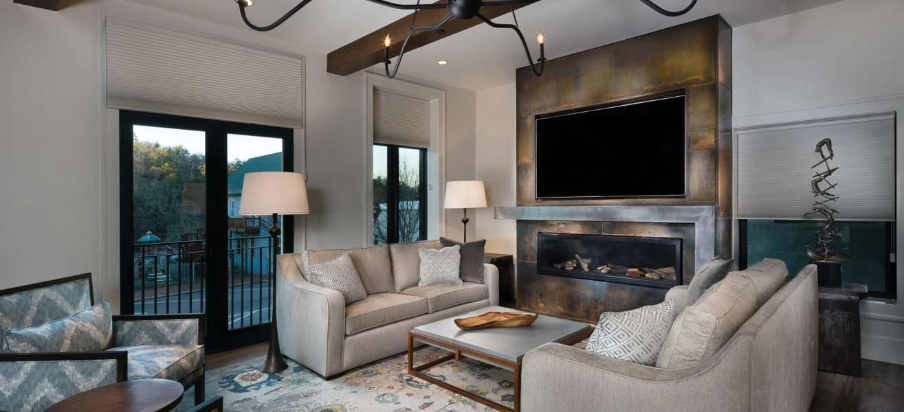 a living room with a fireplace and couches