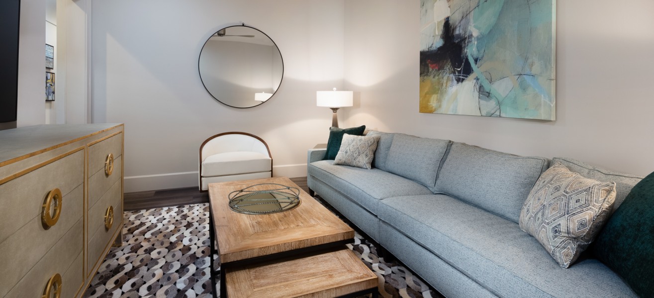 a living room with a couch and a table