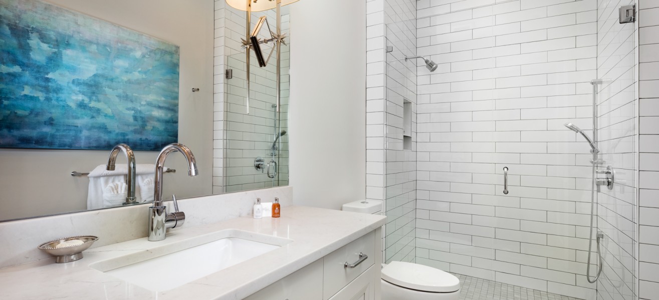 a bathroom with a sink and shower