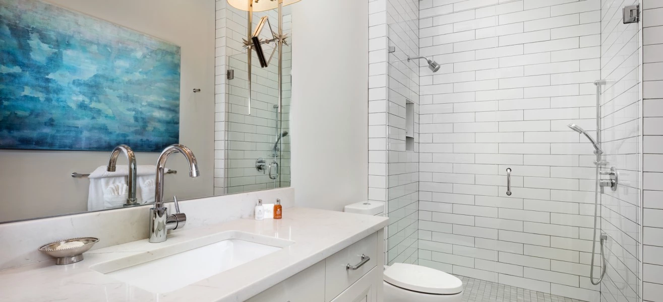 a bathroom with a sink and shower