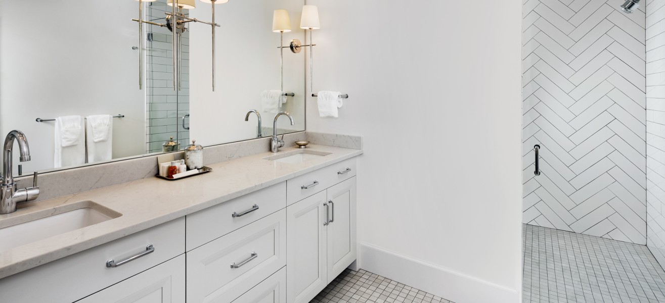 a bathroom with a mirror and sink