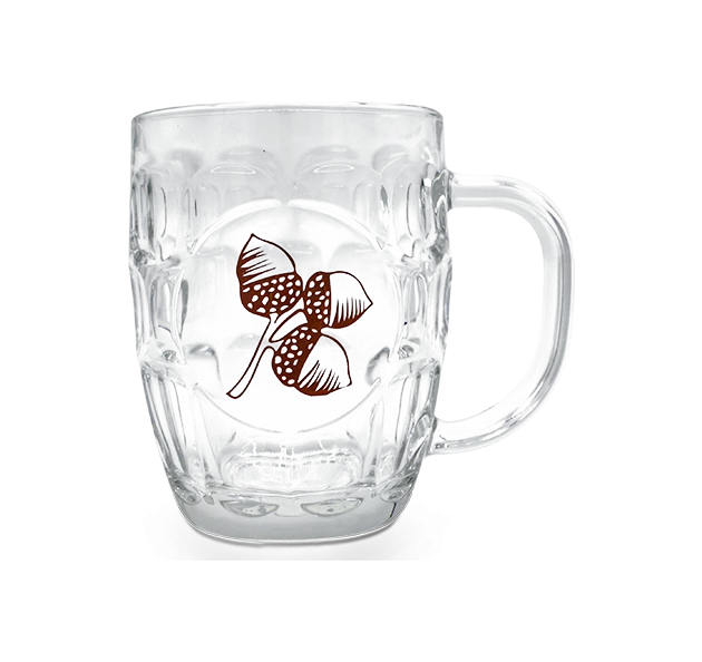 a glass mug with a design on it