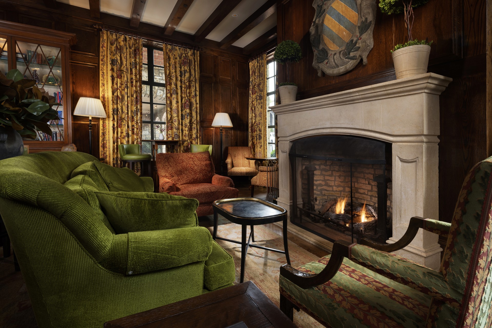 a room with a fireplace and chairs