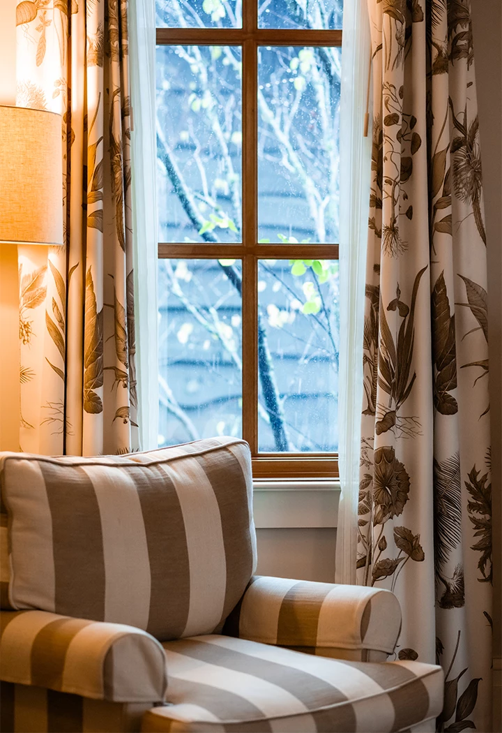a window with curtains and a couch
