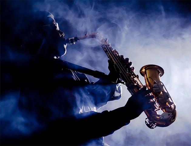 a man playing a saxophone